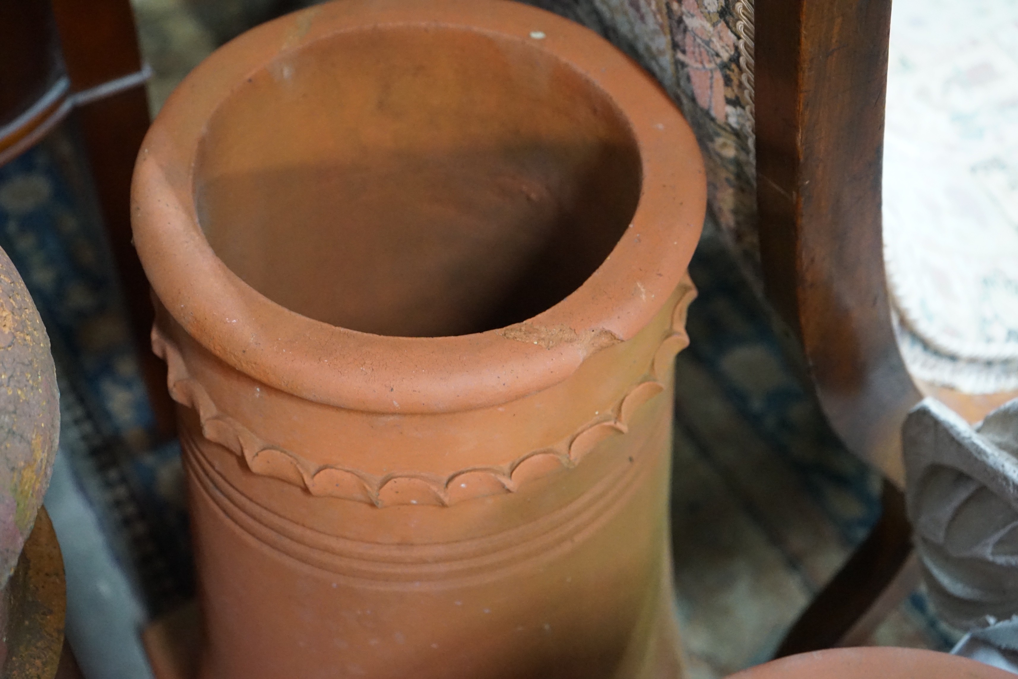 Three terracotta chimney pots, largest height 62cm